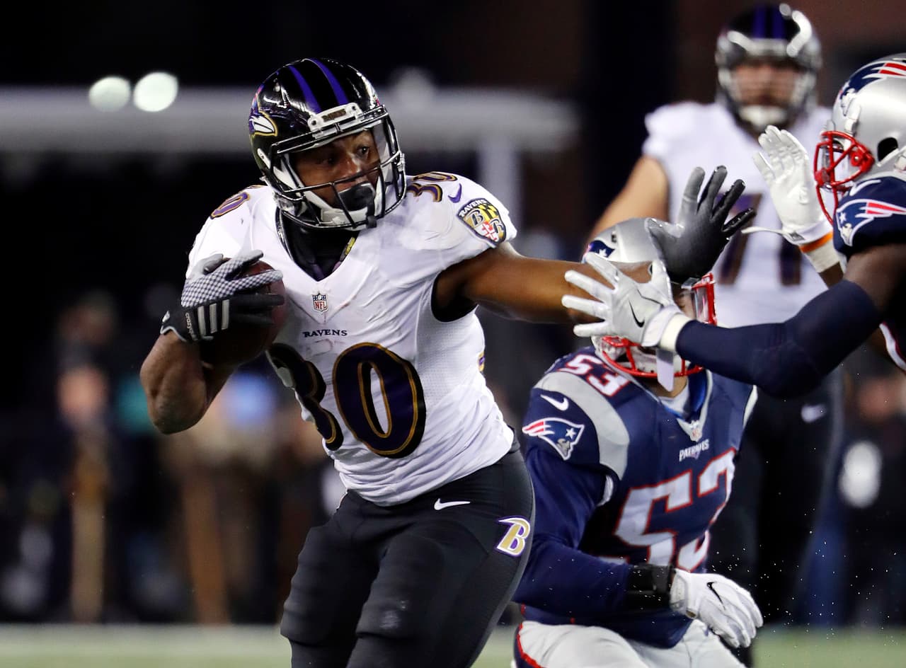 Baltimore Ravens running back Kenneth Dixon runs against the New England Patriots during an NFL football game at Gillette Stadium in Foxborough, Mass. Monday, Dec. 12, 2016. (Winslow Townson/AP Images for Panini)