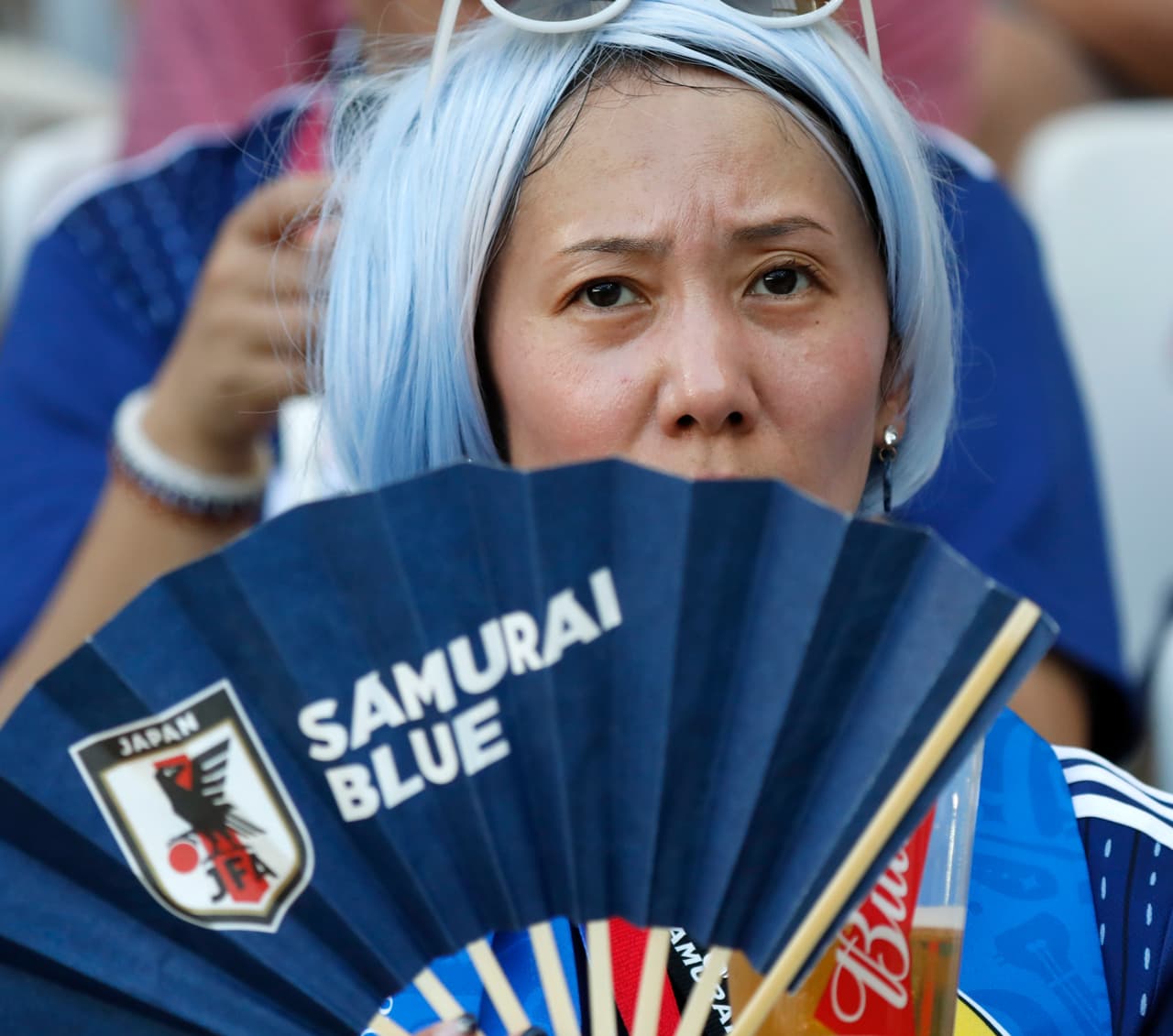 A fan of team Japan waits for the start of the group H match between Japan and Poland at the 2018 soccer World Cup at the Volgograd Arena in Volgograd, Russia, Thursday, June 28, 2018. (AP Photo/Eugene Hoshiko)