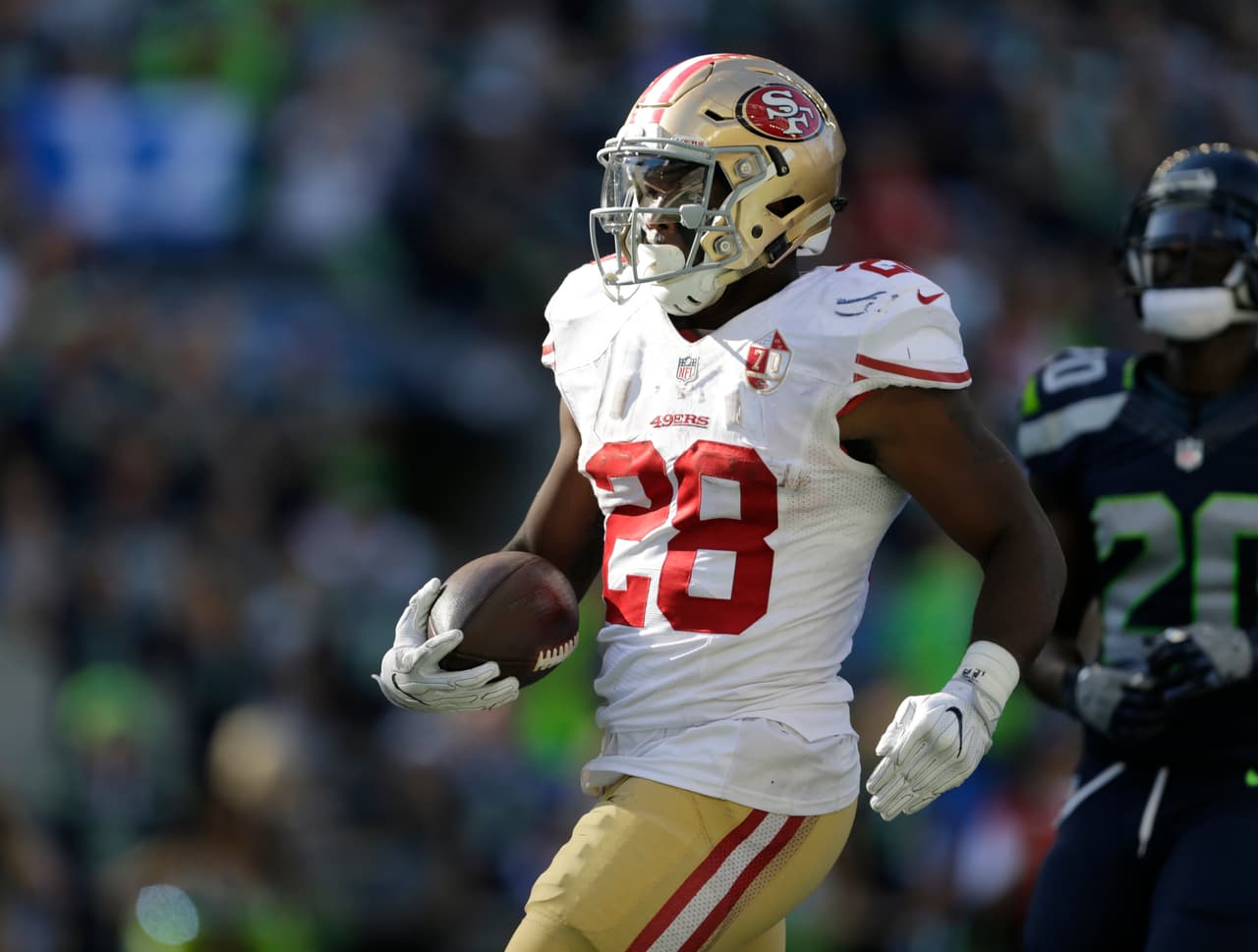 San Francisco 49ers' Carlos Hyde scores against the Seattle Seahawks in the second half of an NFL football game, Sunday, Sept. 25, 2016, in Seattle. (AP Photo/John Froschauer)