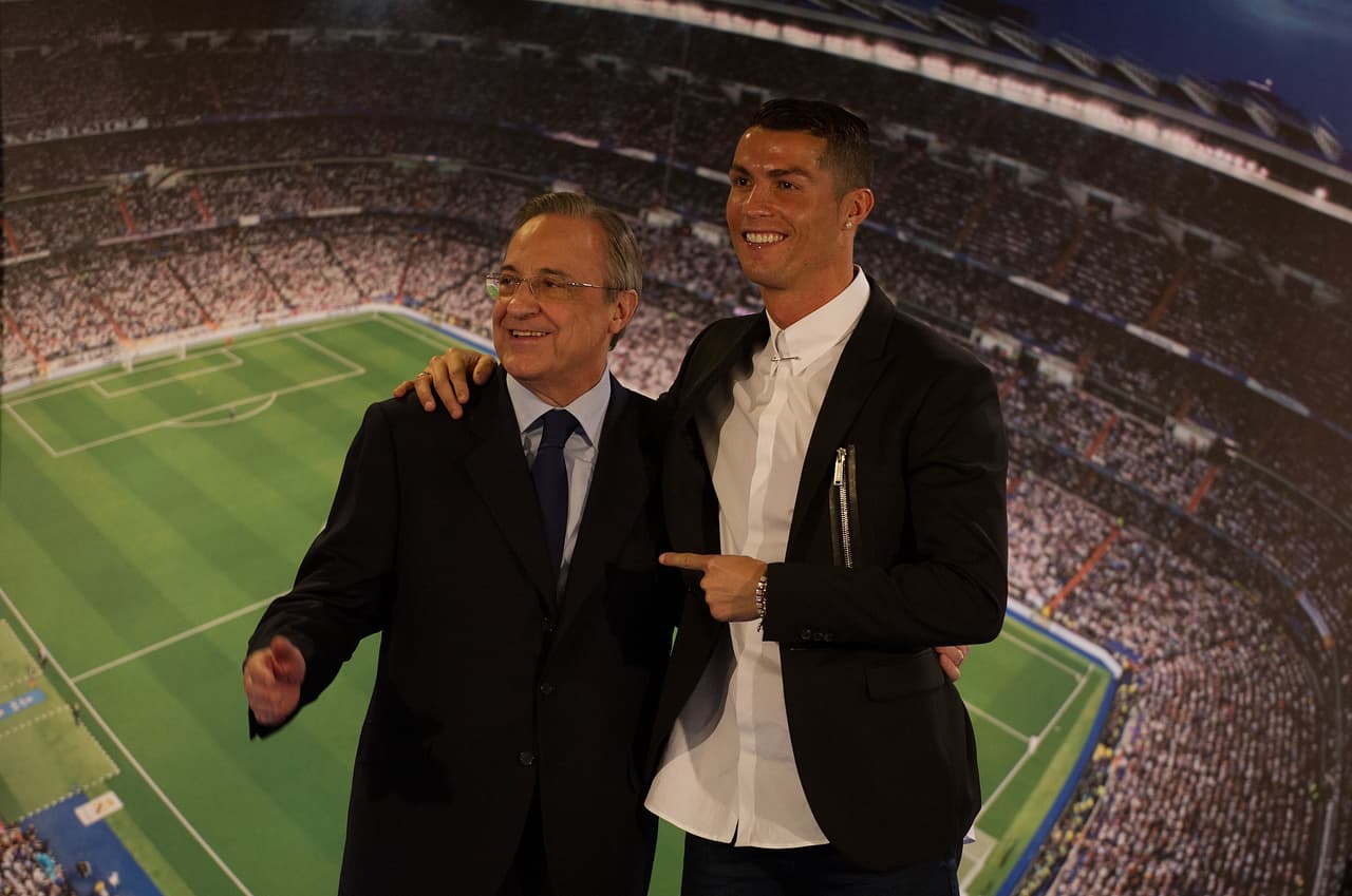 MADRID, SPAIN - NOVEMBER 07: Cristiano Ronaldo of Real Madrid embraces club President Florentino Perez following his press conference after signing a new five-year contract with the Spanish club at the Santiago Bernabeu stadium on November 7, 2016 in Madrid, Spain. (Photo by Denis Doyle/Getty Images)