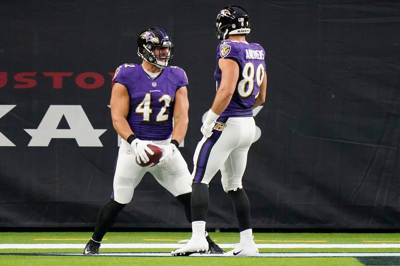 Baltimore Ravens fullback Patrick Ricard (42) celebrates his touchdown catch with teammate Mark Andrews (89) during the first half of an NFL football game against the Houston Texans, Sunday, Sept.20, 2020, in Houston. (AP Photo/David J. Phillip)