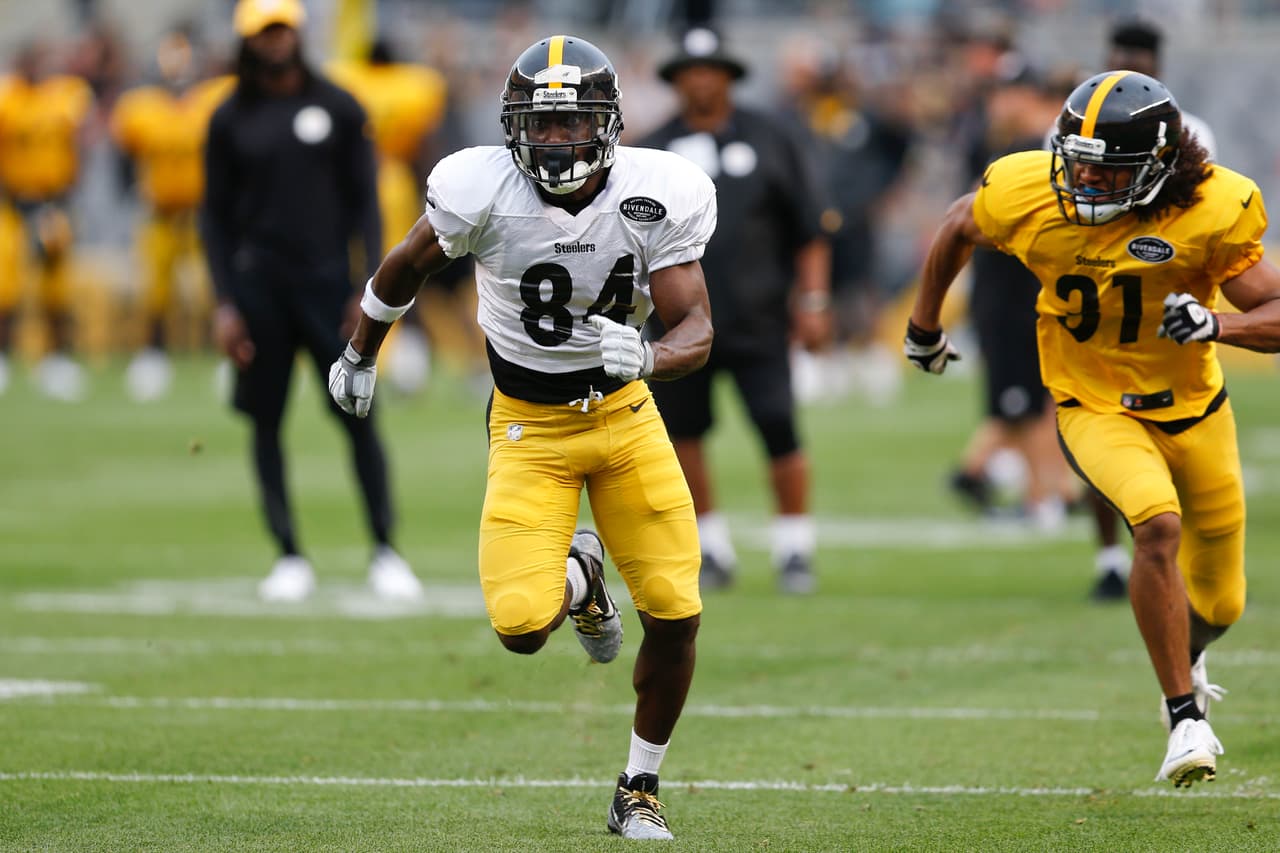 Pittsburgh Steelers wide receiver Antonio Brown (84) runs past cornerback Ross Cockrell (31) during an NFL training camp football practice, Sunday, Aug. 6, 2017, in Pittsburgh. (AP Photo/Keith Srakocic)