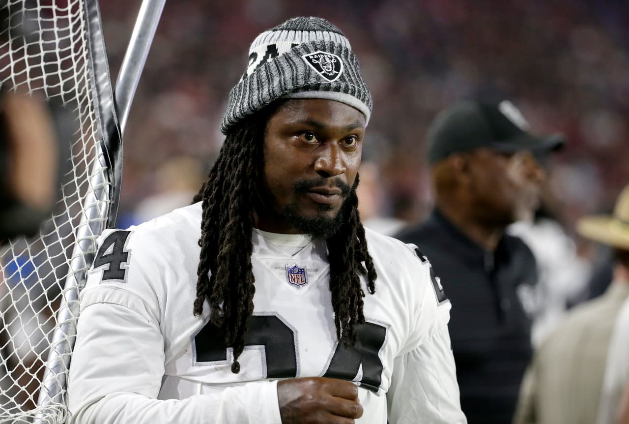 Oakland Raiders running back Marshawn Lynch (24) stands on the sidelines during the second half of an NFL preseason football game against the Arizona Cardinals, Saturday, Aug. 12, 2017, in Glendale, Ariz. (AP Photo/Rick Scuteri)