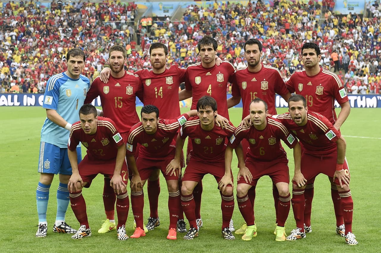 Members of Spain's national team (Back row L-R) Spain's goalkeeper and captain Iker Casillas, Spain's defender Sergio Ramos, Spain's midfielder Xabi Alonso, Spain's midfielder Javi Martinez, Spain's midfielder Sergio Busquets and Spain's forward Diego Costa (Front row L-R) Spain's midfielder Cesar Azpilicueta, Spain's forward Pedro Rodriguez, Spain's midfielder David Silva, Spain's midfielder Andres Iniesta and Spain's defender Jordi Alba pose for the team photo prior to the Group B football match between Spain and Chile in the Maracana Stadium in Rio de Janeiro during the 2014 FIFA World Cup on June 18, 2014. AFP PHOTO / LLUIS GENE (Photo credit should read LLUIS GENE/AFP/Getty Images)