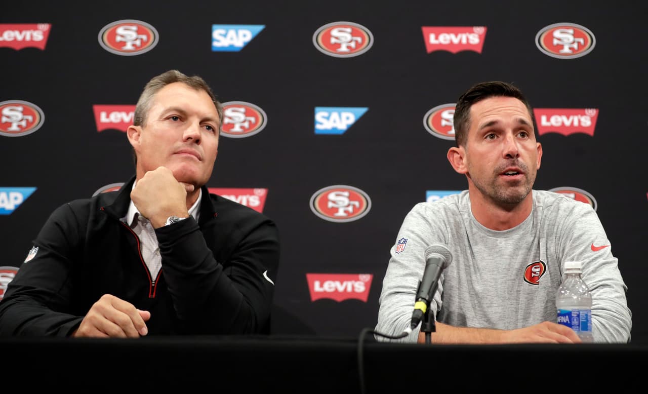 San Francisco 49ers head coach Kyle Shanahan, right, and general manager John Lynch field questions during the NFL team's football training camp Thursday, July 27, 2017, in Santa Clara, Calif. (AP Photo/Marcio Jose Sanchez)