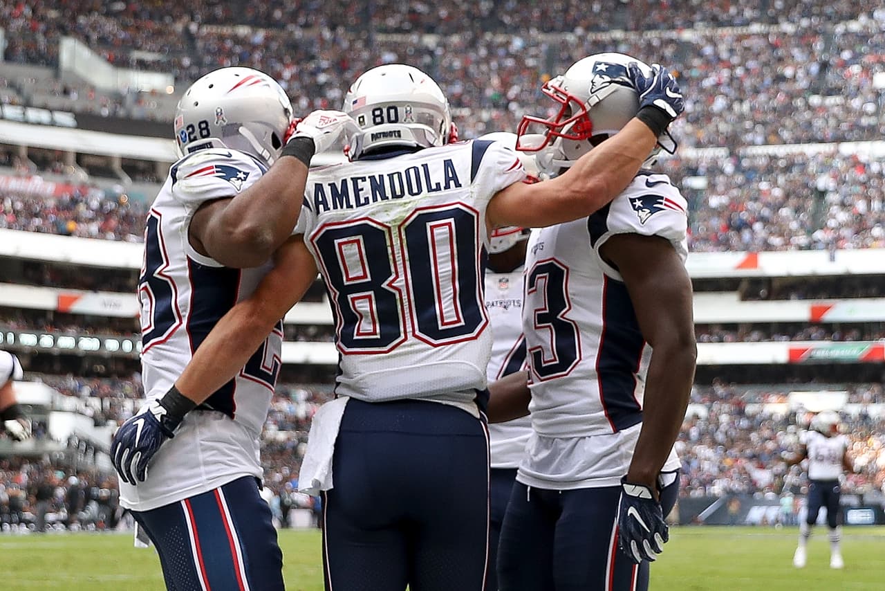 MEXICO CITY, MEXICO - NOVEMBER 19: Danny Amendola #80 of the New England Patriots celebrates with teammates after a touchdown against the Oakland Raiders during the first half at Estadio Azteca on November 19, 2017 in Mexico City, Mexico. (Photo by Buda Mendes/Getty Images)