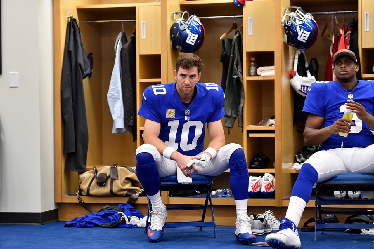 New York Giants quarterback Eli Manning (10) sits at his locker before a NFL football game against the Los Angeles Rams on Sunday, November 5, 2017 in East Rutherford, N.J. (Evan Pinkus via AP)
