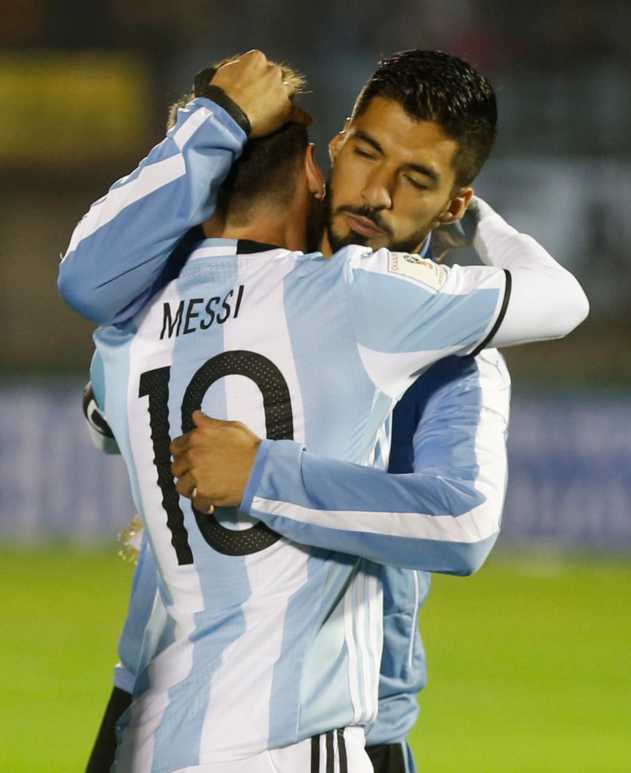 MONTEVIDEO, URUGUAY - AUGUST 31: Lionel Messi of Argentina and Luis Suarez of Uruguay hug each other prior to a match between Uruguay and Argentina as part of FIFA 2018 World Cup Qualifiers at Centenario Stadium on August 31, 2017 in Montevideo, Uruguay. (Photo by Gabriel Rossi/Getty Images)