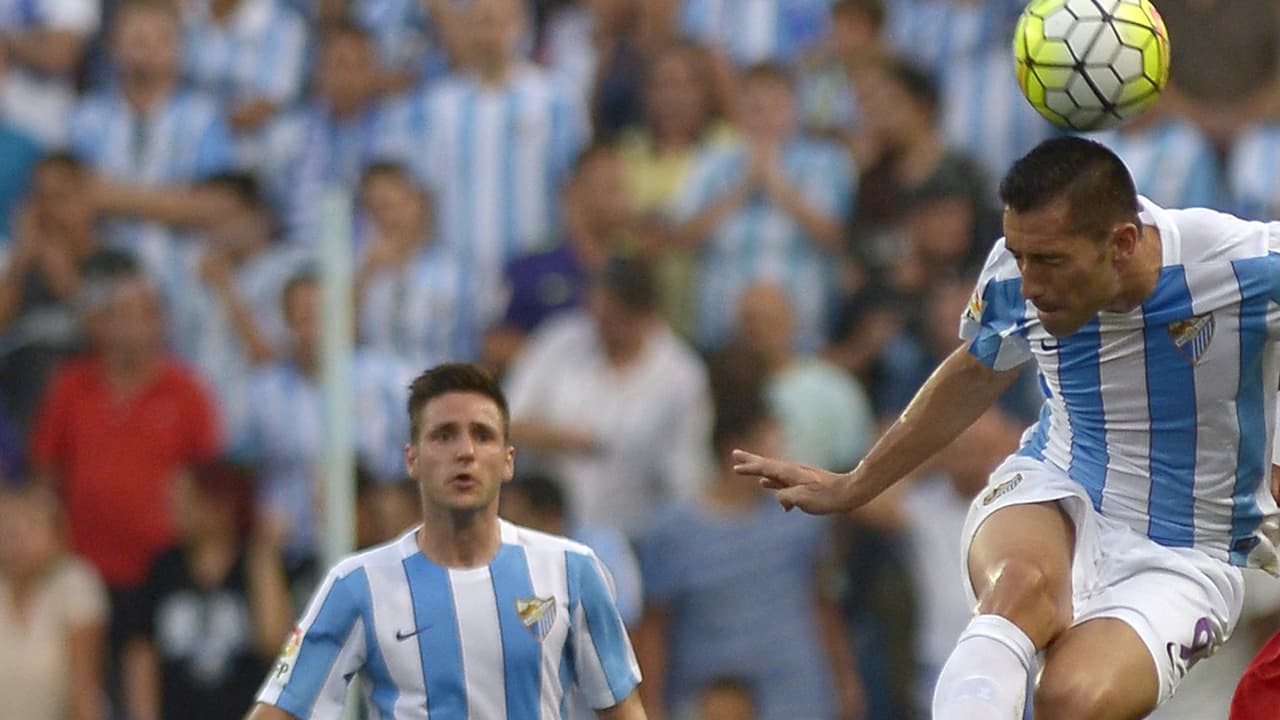 Charles (derecha) hizo los goles del Málaga.