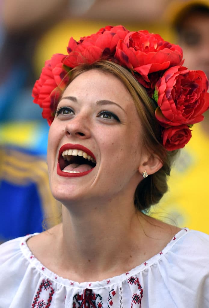 A Poland supporter cheers prior to the Euro 2016 group C football match between Ukraine and Poland at the Velodrome stadium in Marseille on June 21, 2016. / AFP / BORIS HORVAT (Photo credit should read BORIS HORVAT/AFP/Getty Images)