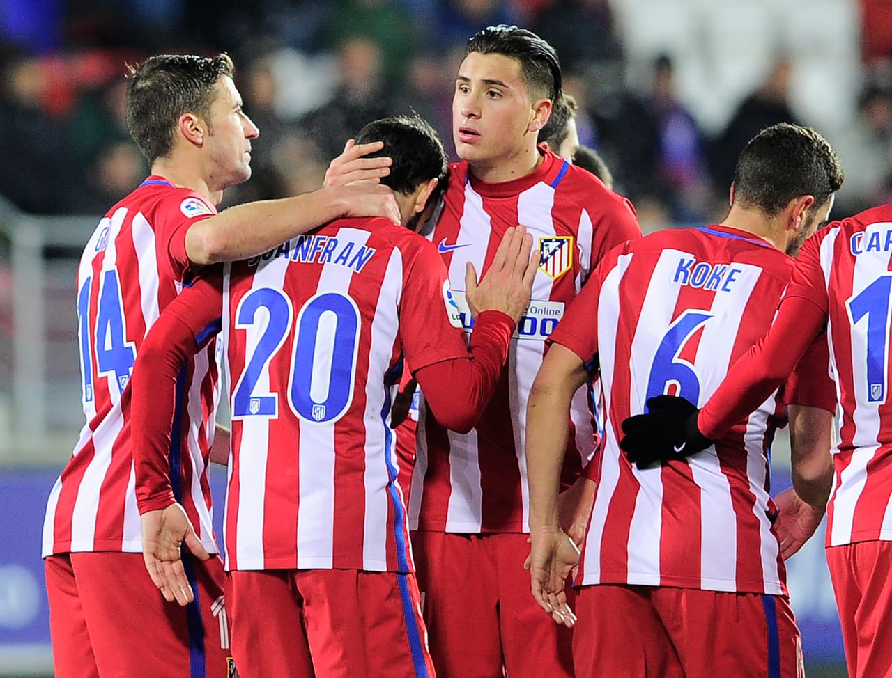 Atletico Madrid's players celebrate after defender Juanfran scored their team's second goal during the Spanish Copa del Rey (King's Cup) quarter final second leg football match SD Eibar vs Club Atletico de Madrid at the Ipurua Municipal stadium on January 25, 2017. / AFP / ANDER GILLENEA (Photo credit should read ANDER GILLENEA/AFP/Getty Images)