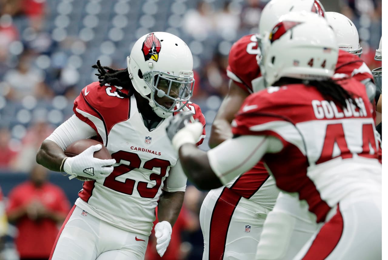 FILE - In this Aug. 28, 2016, file photo, Arizona Cardinals running back Chris Johnson (23) warms up prior to an NFL preseason football game against the Houston Texans in Houston. Johnson was on his way to his seventh 1,000-yard season in eight years before getting hurt last season. He ran for 814 yards in 11 games. His injury gave David Johnson an opportunity to play more and he was dynamic. The Cardinals are good hands with either Johnson, but expect David to get the ball more than Chris. (AP Photo/Jeff Roberson, File)