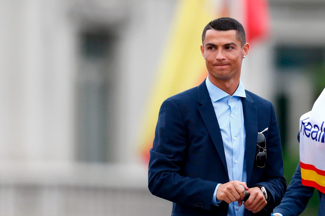 Real Madrid's Portuguese forward Cristiano Ronaldo gestures at Cibeles square in Madrid on May 27, 2018 after Real Madrid won their third Champions League title in a row in Kiev. (Photo by BENJAMIN CREMEL / AFP) (Photo credit should read BENJAMIN CREMEL/AFP/Getty Images)