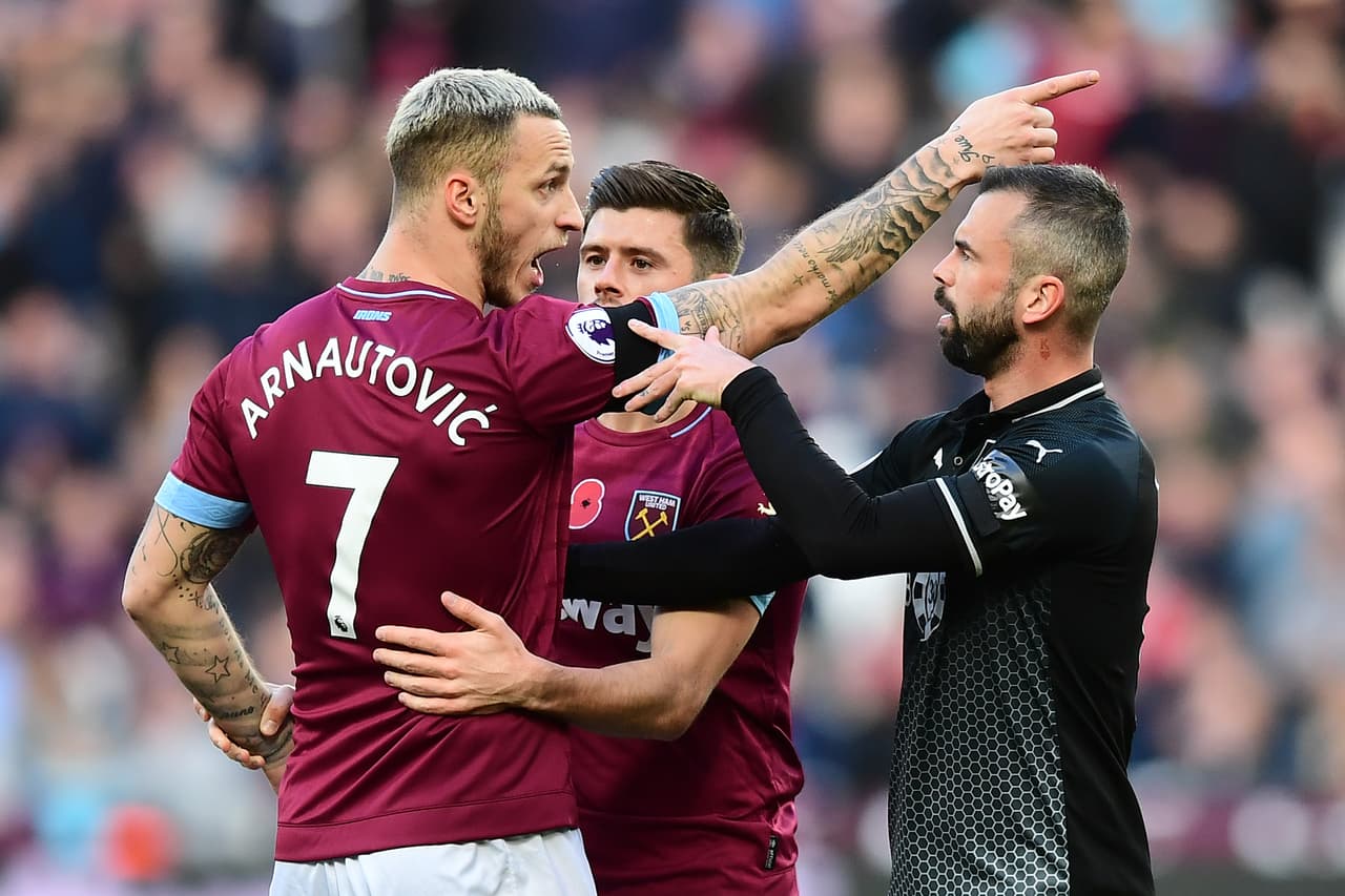 LONDON, ENGLAND - NOVEMBER 03: Marko Arnautovic of West Ham United argues with Steven Defour of Burnley during the Premier League match between West Ham United and Burnley FC at London Stadium on November 3, 2018 in London, United Kingdom. (Photo by Alex Broadway/Getty Images)