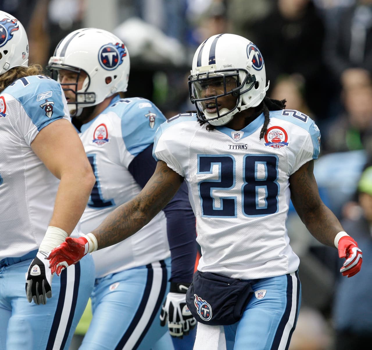 Tennessee Titans Chris Johnson celebrates his touchdown in the first quarter against the Seattle Seahawks, Sunday, Jan. 3, 2010, during an NFL football game in Seattle. (AP Photo/Elaine Thompson)