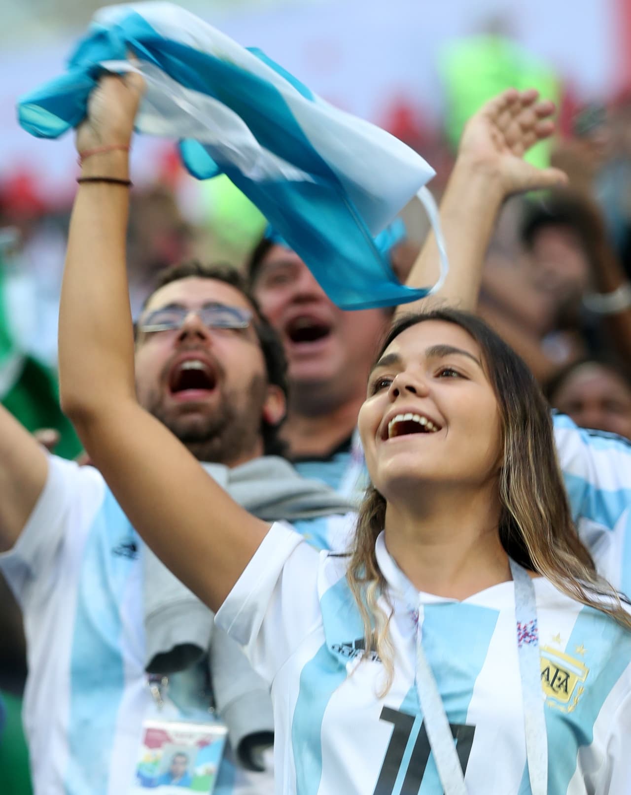 St.petersburg (Russian Federation), 26/06/2018.- Supporters of Argentina cheer prior to the FIFA World Cup 2018 group D preliminary round soccer match between Nigeria and Argentina in St.Petersburg, Russia, 26 June 2018. (RESTRICTIONS APPLY: Editorial Use Only, not used in association with any commercial entity - Images must not be used in any form of alert service or push service of any kind including via mobile alert services, downloads to mobile devices or MMS messaging - Images must appear as still images and must not emulate match action video footage - No alteration is made to, and no text or image is superimposed over, any published image which: (a) intentionally obscures or removes a sponsor identification image; or (b) adds or overlays the commercial identification of any third party which is not officially associated with the FIFA World Cup) (Mundial de Fútbol, Rusia) EFE/EPA/TOLGA BOZOGLU EDITORIAL USE ONLY