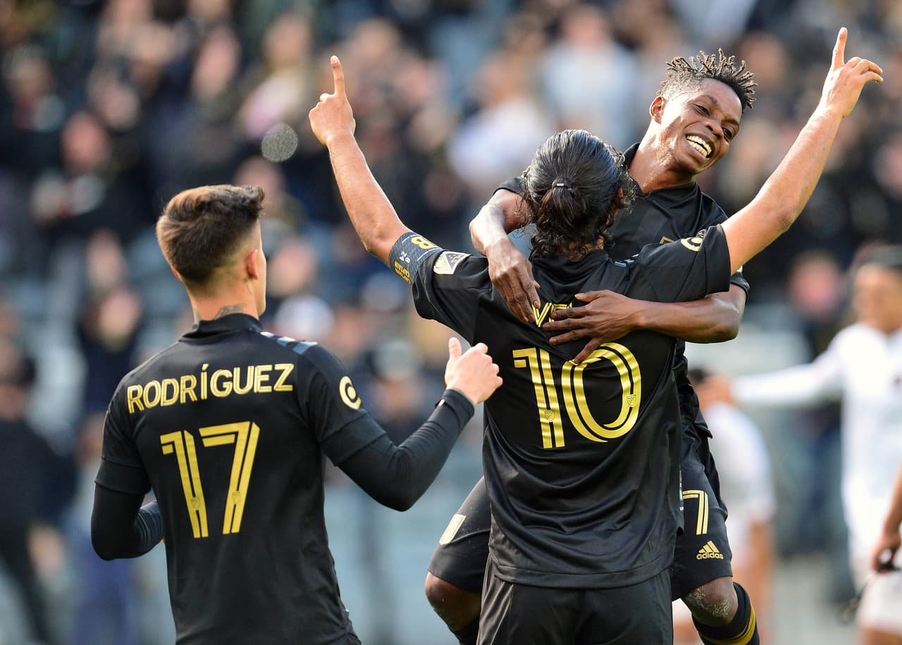 March 1, 2020; Los Angeles, CA, USA; Los Angeles FC forward Carlos Vela (10) celebrates his goal scored against Inter Miami CF with midfielder Latin Blessing (7) and forward Brian Rodriguez (17) during the first half at Banc Of California Stadium. Mandatory Credit: Gary A. Vasquez-USA TODAY Sports