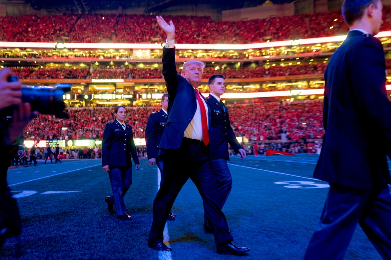 President Donald Trump walks off the field following the national anthem before the start of the NCAA National Championship game at Mercedes-Benz Stadium, Monday, Jan. 8, 2018, in Atlanta, between Alabama and Georgia. (AP Photo/Andrew Harnik)