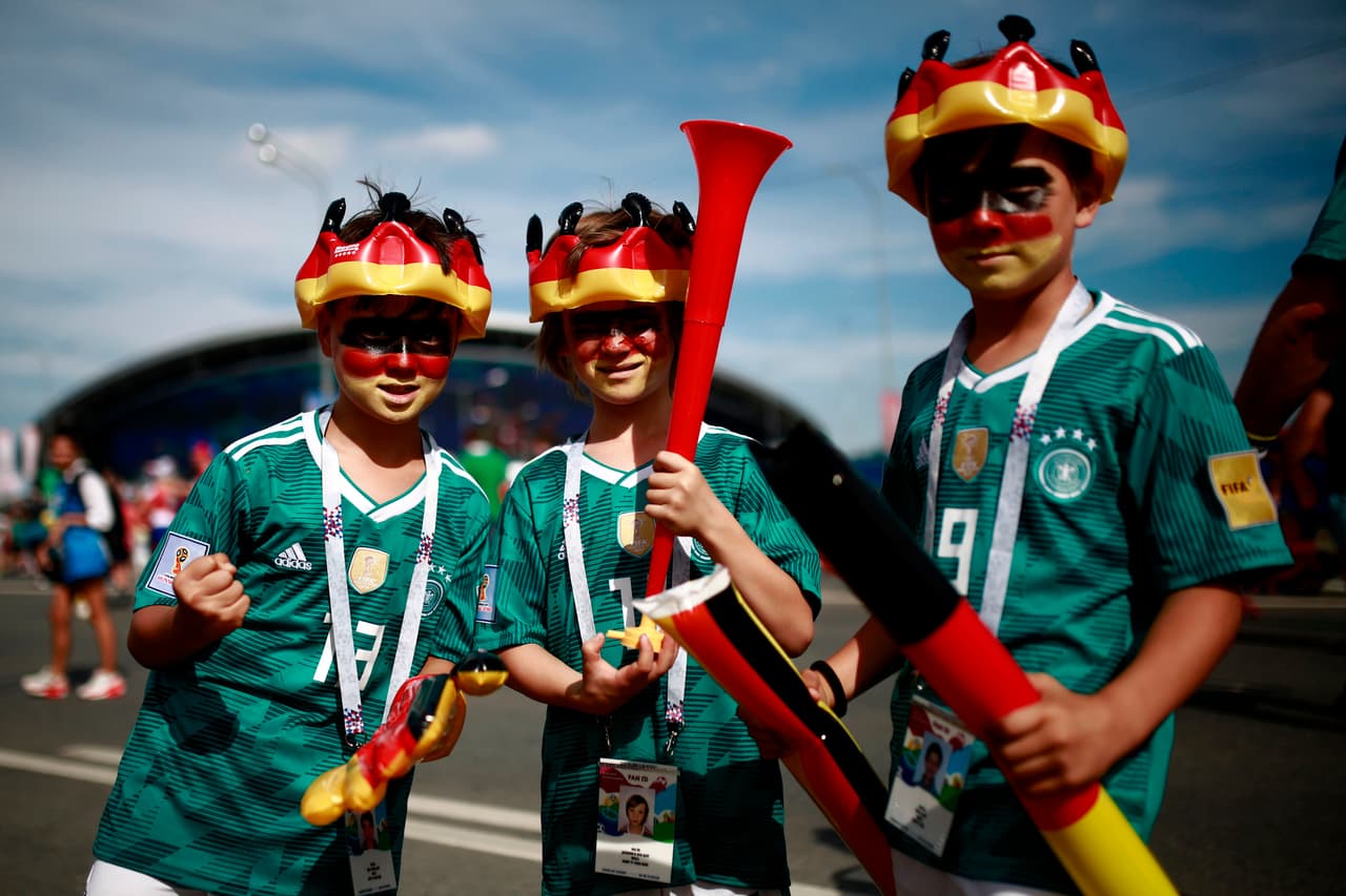 Germany supporters pose for a picture ahead of the Russia 2018 World Cup Group F football match between South Korea and Germany at the Kazan Arena in Kazan on June 27, 2018. (Photo by Benjamin CREMEL / AFP) / RESTRICTED TO EDITORIAL USE - NO MOBILE PUSH ALERTS/DOWNLOADS (Photo credit should read BENJAMIN CREMEL/AFP/Getty Images)
