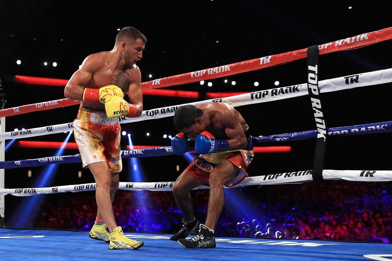 LOS ANGELES, CA - AUGUST 05: Vasyl Lomachenko (L) of Ukraine exchanges punches with Miguel Marriaga of Columbia at during their WBO World Championship Junior Lightweight title fight at the Microsoft Theater on August 5, 2017 in Los Angeles, California. (Photo by Sean M. Haffey/Getty Images)
