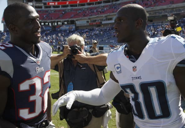 NASHVILLE, TN - SEPTEMBER 9: New England Patriots cornerback Devin McCourty (#32) and his brother, Tennessee Titans cornerback Jason McCourty (#30,) get together on the field after the the New England Patriots season opener against the Tennessee Titans at LP Field in Nashville. (Photo by Barry Chin/The Boston Globe via Getty Images)