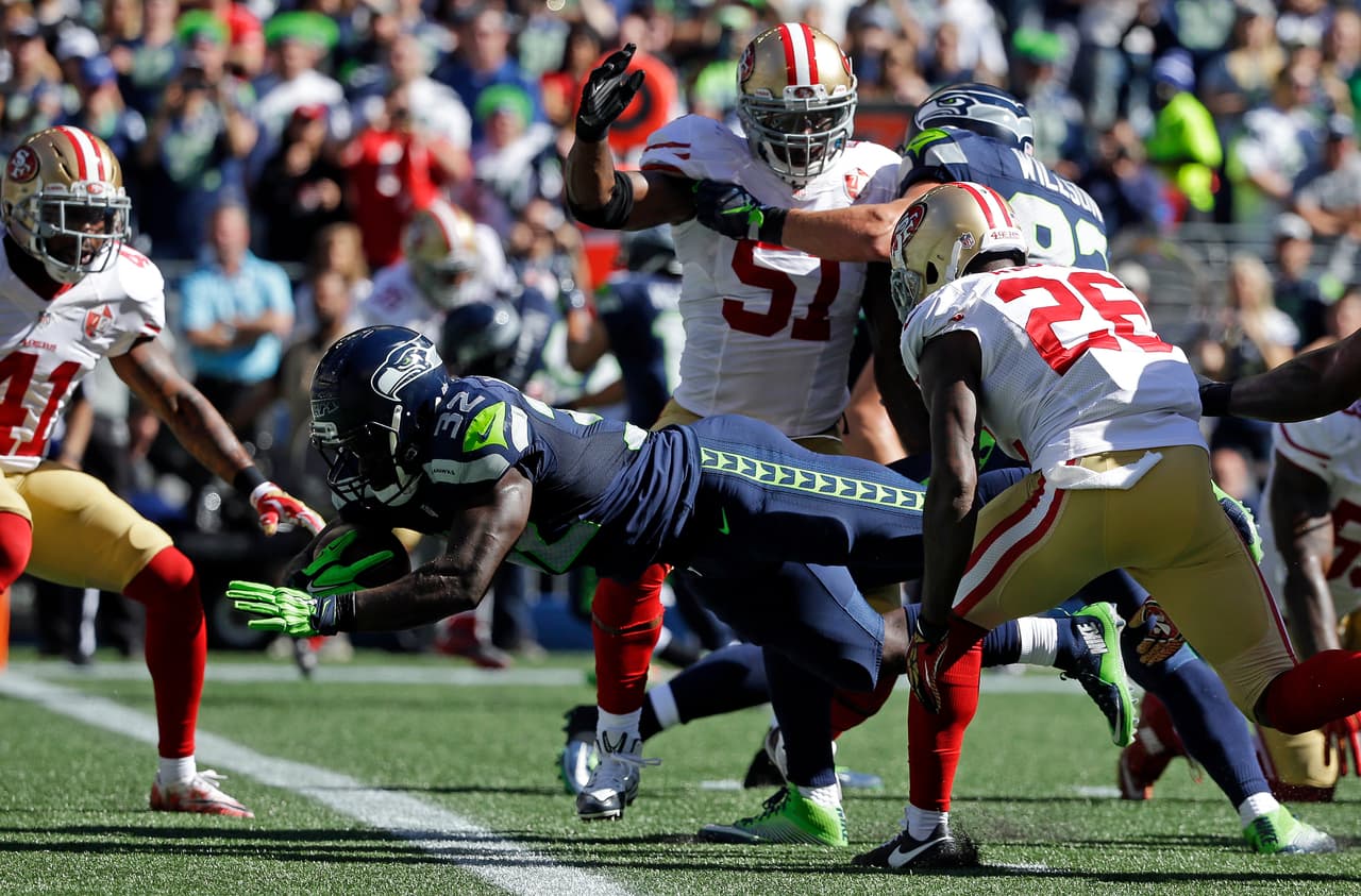 Seattle Seahawks' Christine Michael (32) dives into the end zone for a touchdown against the San Francisco 49ers in the first half of an NFL football game, Sunday, Sept. 25, 2016, in Seattle. (AP Photo/Ted S. Warren)