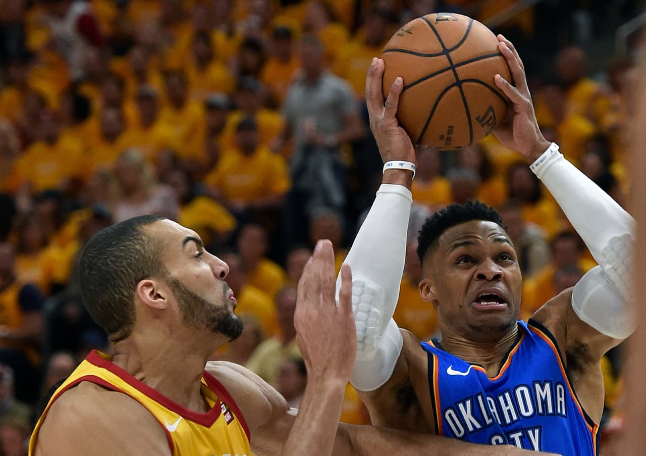 SALT LAKE CITY, UT - APRIL 21: Russell Westbrook #0 of the Oklahoma City Thunder shoots past Rudy Gobert #27 of the Utah Jazz in the first half during Game Three of Round One of the 2018 NBA Playoffs at Vivint Smart Home Arena on April 21, 2018 in Salt Lake City, Utah. NOTE TO USER: User expressly acknowledges and agrees that, by downloading and or using this photograph, User is consenting to the terms and conditions of the Getty Images License Agreement. (Photo by Gene Sweeney Jr./Getty Images)