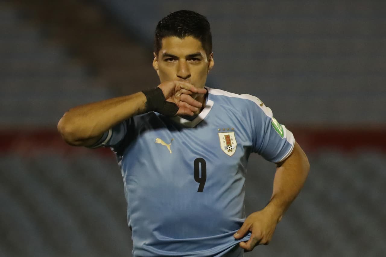 MONTEVIDEO, URUGUAY - OCTOBER 08: Luis Suarez of Uruguay celebrates after scoring the opening goal of his team during a match between Uruguay and Chile as part of South American Qualifiers for Qatar 2022 at Centenario Stadium on October 08, 2020 in Montevideo, Uruguay. (Photo by Raul Martinez -Pool/Getty Images)