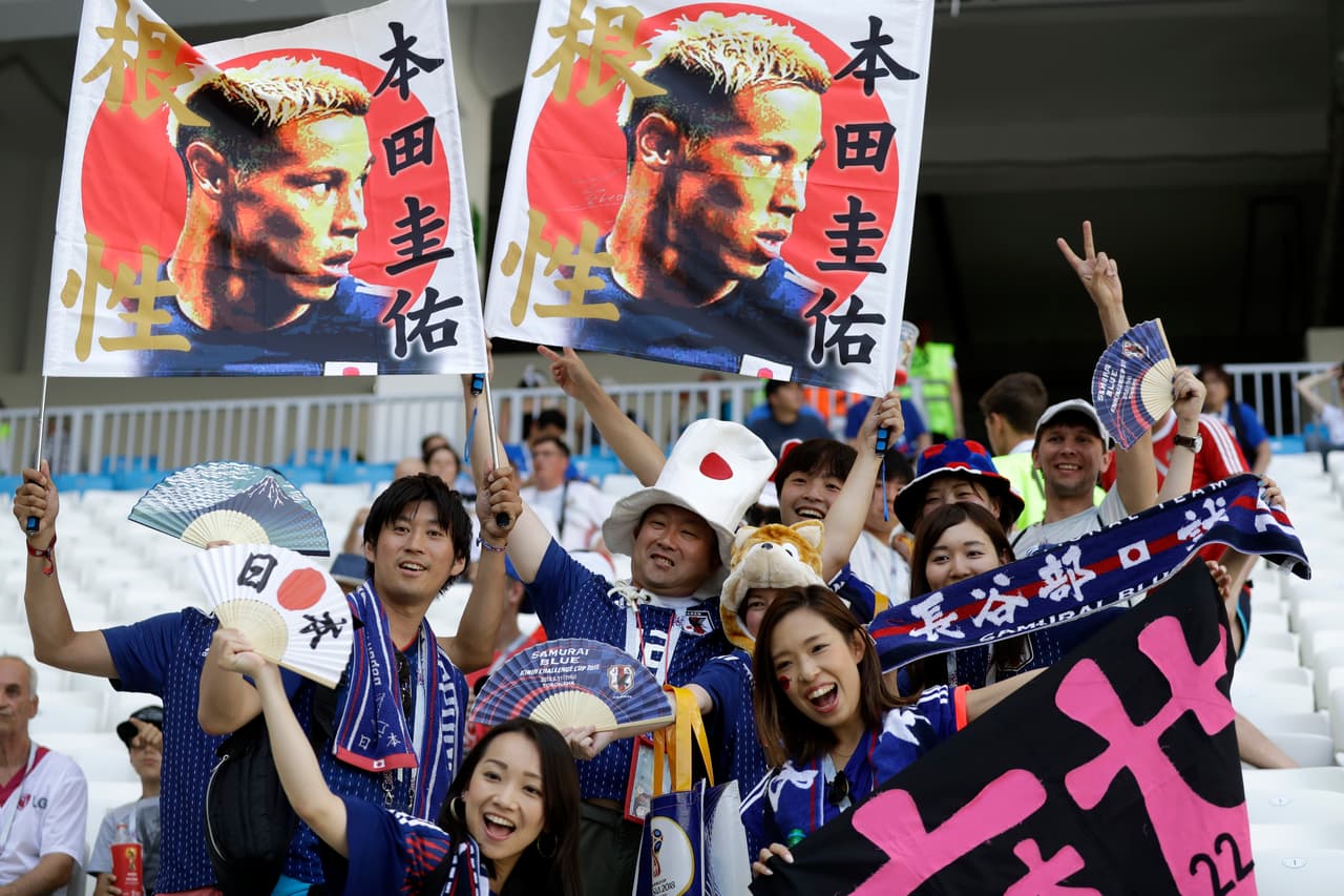 Japanese fans pose before the start of the group H match between Japan and Poland at the 2018 soccer World Cup at the Volgograd Arena in Volgograd, Russia, Thursday, June 28, 2018. (AP Photo/Andrew Medichini)