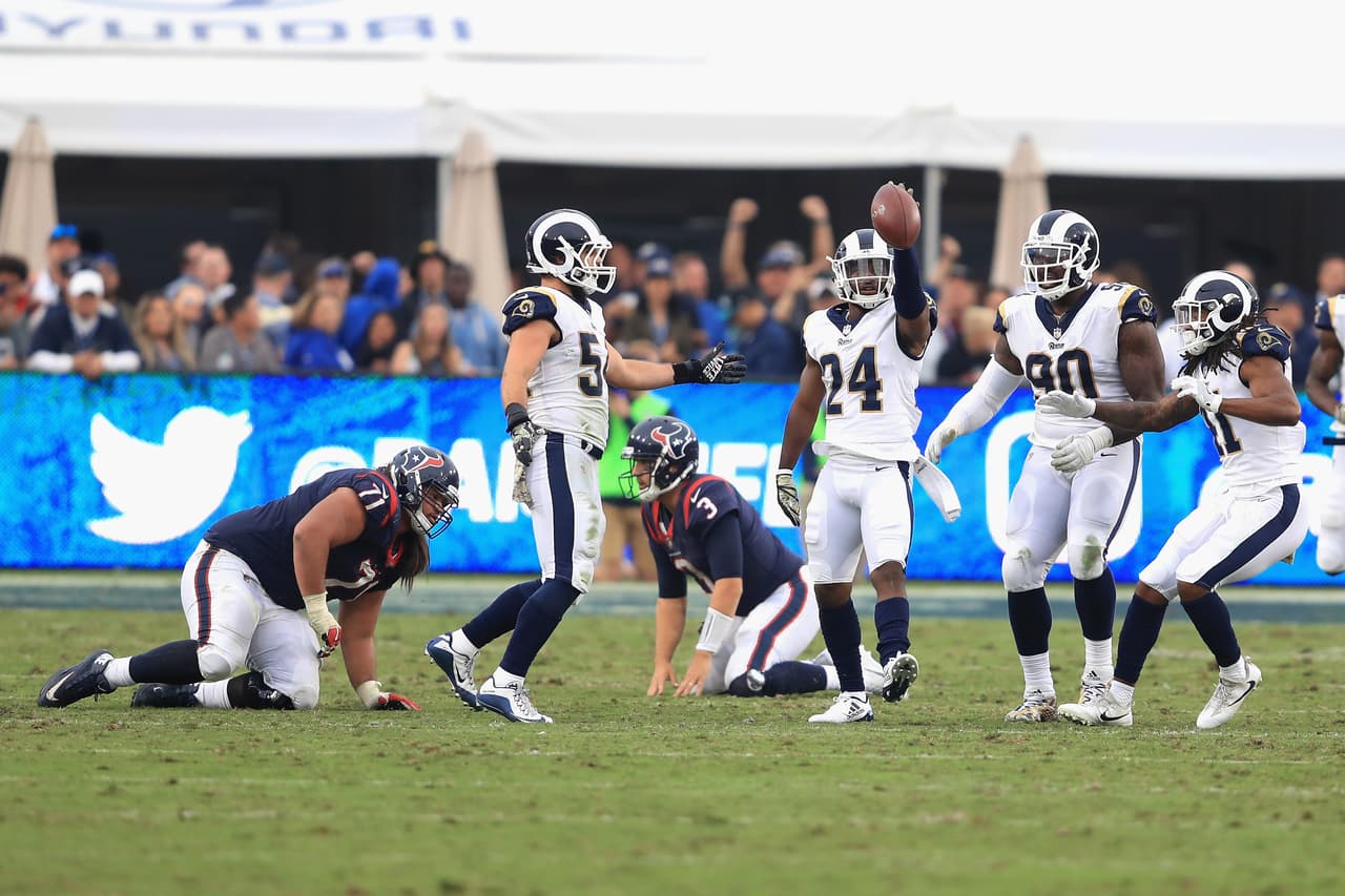 LOS ANGELES, CA - NOVEMBER 12: Bryce Hager #54 and Michael Brockers #90 of the Los Angeles Rams congratulate Blake Countess #24 of the Los Angeles Rams after his interception as Xavier Su'a-Filo #71 and Tom Savage #3 of the Houston Texans look on during the second half of game at Los Angeles Memorial Coliseum on November 12, 2017 in Los Angeles, California. (Photo by Sean M. Haffey/Getty Images)