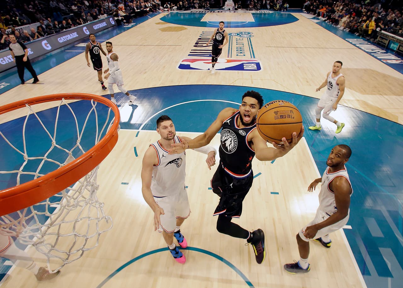 CHARLOTTE, NORTH CAROLINA - FEBRUARY 17: Karl-Anthony Towns #32 of the Minnesota Timberwolves and Team LeBron shoots against Nikola Vučević #9 of the Orlando Magic and Team Giannis during the NBA All-Star game as part of the 2019 NBA All-Star Weekend at Spectrum Center on February 17, 2019 in Charlotte, North Carolina. Team LeBron won 178-164. NOTE TO USER: User expressly acknowledges and agrees that, by downloading and/or using this photograph, user is consenting to the terms and conditions of the Getty Images License Agreement. (Photo by Streeter Lecka/Getty Images)