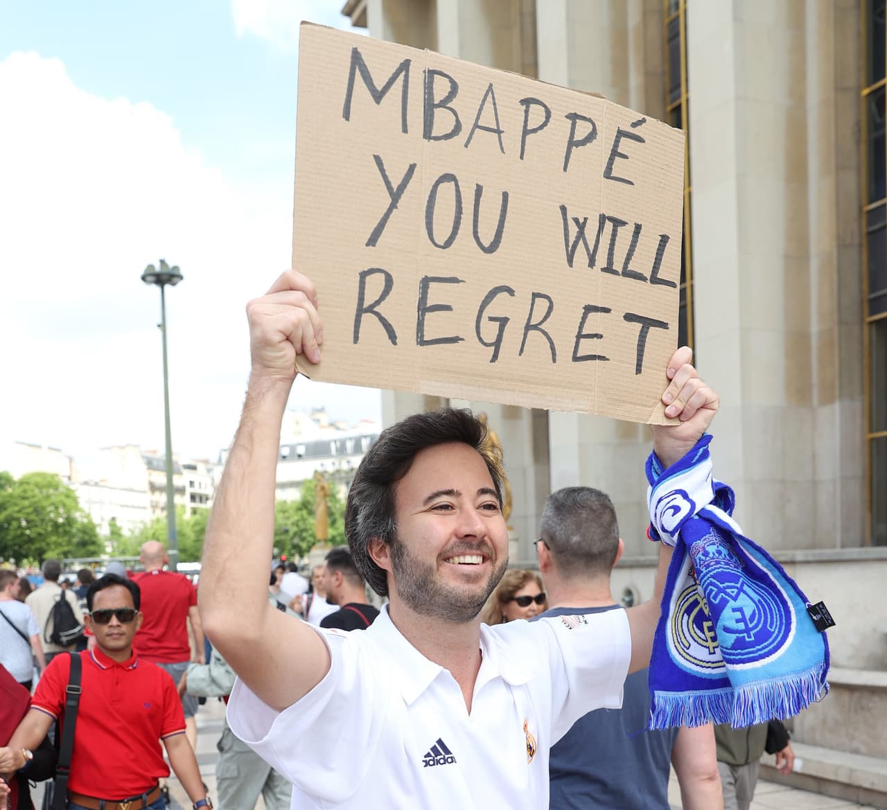 PARIS, FRANCE - MAY 28: A Real Madrid fan holds up a sign referencing Kylian Mbappe prior to the UEFA Champions League final match between Liverpool FC and Real Madrid at Stade de France on May 28, 2022 in Paris, France. (Photo by Julian Finney/Getty Images)