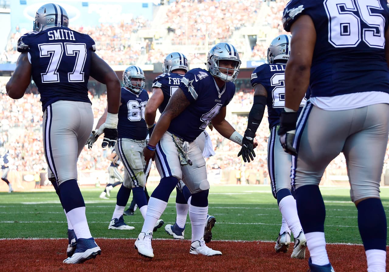 CLEVELAND, OH - NOVEMBER 06: Dak Prescott #4 of the Dallas Cowboys celebrates with teammates after Ezekiel Elliott #21 scored on a 8 yard touchdown against the Cleveland Browns at FirstEnergy Stadium on November 6, 2016 in Cleveland, Ohio. (Photo by Jason Miller/Getty Images)