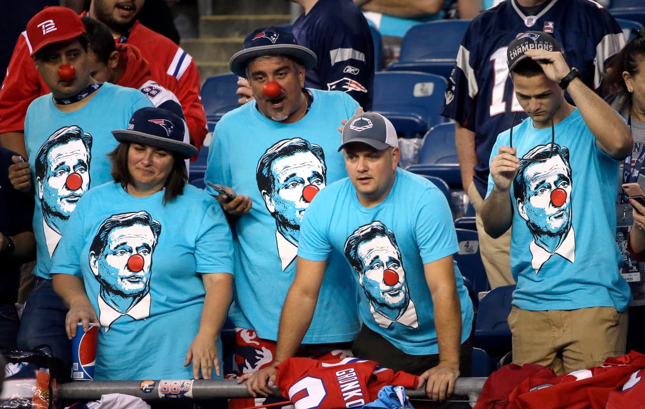 New England Patriots fans, wearing T-shirts bearing the likeness of NFL Commissioner Roger Goodell, watch from the stands before an NFL football game between the Patriots and the Kansas City Chiefs, Thursday, Sept. 7, 2017, in Foxborough, Mass. (AP Photo/Michael Dwyer)