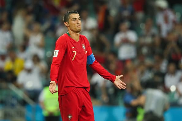 SOCHI, RUSSIA - JUNE 15: Cristiano Ronaldo of Portugal reacts after Nacho of Spain scored a goal to make it -2-3 during the 2018 FIFA World Cup Russia group B match between Portugal and Spain at Fisht Stadium on June 15, 2018 in Sochi, Russia. (Photo by Matthew Ashton - AMA/Getty Images)