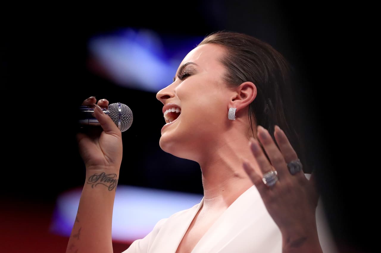 LAS VEGAS, NV - AUGUST 26: Singer Demi Lovato performs the national anthem prior to the super welterweight boxing match between Floyd Mayweather Jr. and Conor McGregor on August 26, 2017 at T-Mobile Arena in Las Vegas, Nevada. (Photo by Christian Petersen/Getty Images)