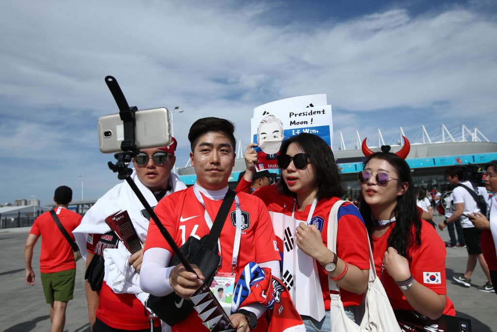 ROSTOV-ON-DON, RUSSIA - JUNE 23: Korea Republic fans enjoy the pre match atmosphere prior to the 2018 FIFA World Cup Russia group F match between Korea Republic and Mexico at Rostov Arena on June 23, 2018 in Rostov-on-Don, Russia. (Photo by Jan Kruger/Getty Images)