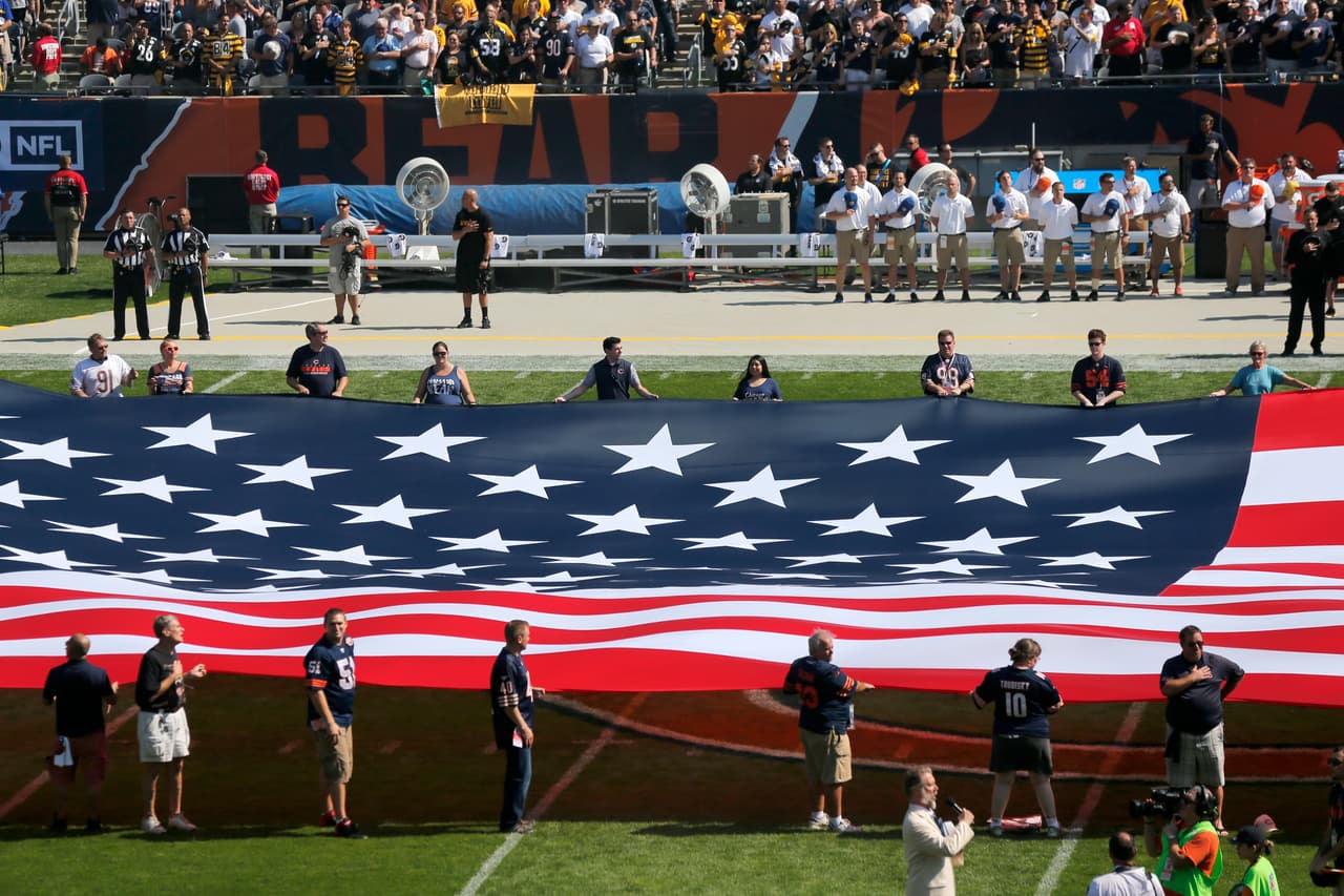 The Pittsburgh Steelers side of the field is nearly empty during the playing of the national anthem before an NFL football game between the Steelers and Chicago Bears, Sunday, Sept. 24, 2017, in Chicago. The Pittsburgh Steelers players did not come out to the field during the anthem. (AP Photo/Kiichiro Sato)