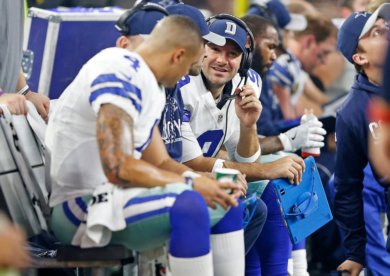 Dallas Cowboys quarterback Tony Romo (9) talks with quarterback Dak Prescott (4) on the bench during the 2016 NFL week 16 regular season game against the Detroit Lions, Monday, Dec. 26, 2016, in Arlington, Texas. The Cowboys defeated the Lions, 42-21. (James D. Smith via AP)