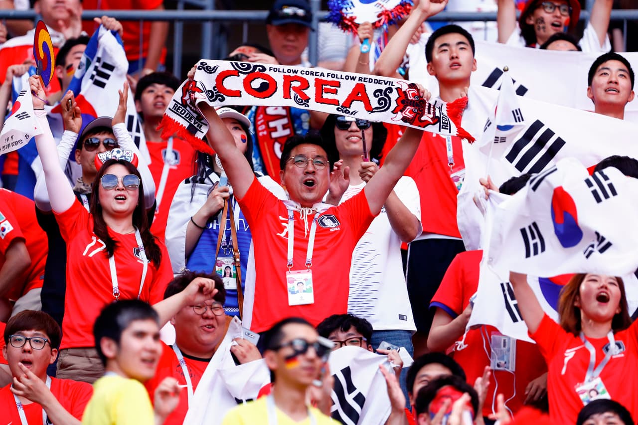 South Korea supporters cheer ahead of the Russia 2018 World Cup Group F football match between South Korea and Germany at the Kazan Arena in Kazan on June 27, 2018. (Photo by BENJAMIN CREMEL / AFP) / RESTRICTED TO EDITORIAL USE - NO MOBILE PUSH ALERTS/DOWNLOADS (Photo credit should read BENJAMIN CREMEL/AFP/Getty Images)