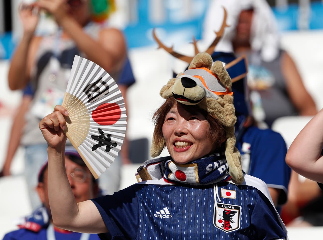A Japanese supporter smiles before the group H match between Japan and Poland at the 2018 soccer World Cup at the Volgograd Arena in Volgograd, Russia, Thursday, June 28, 2018. (AP Photo/Darko Vojinovic)