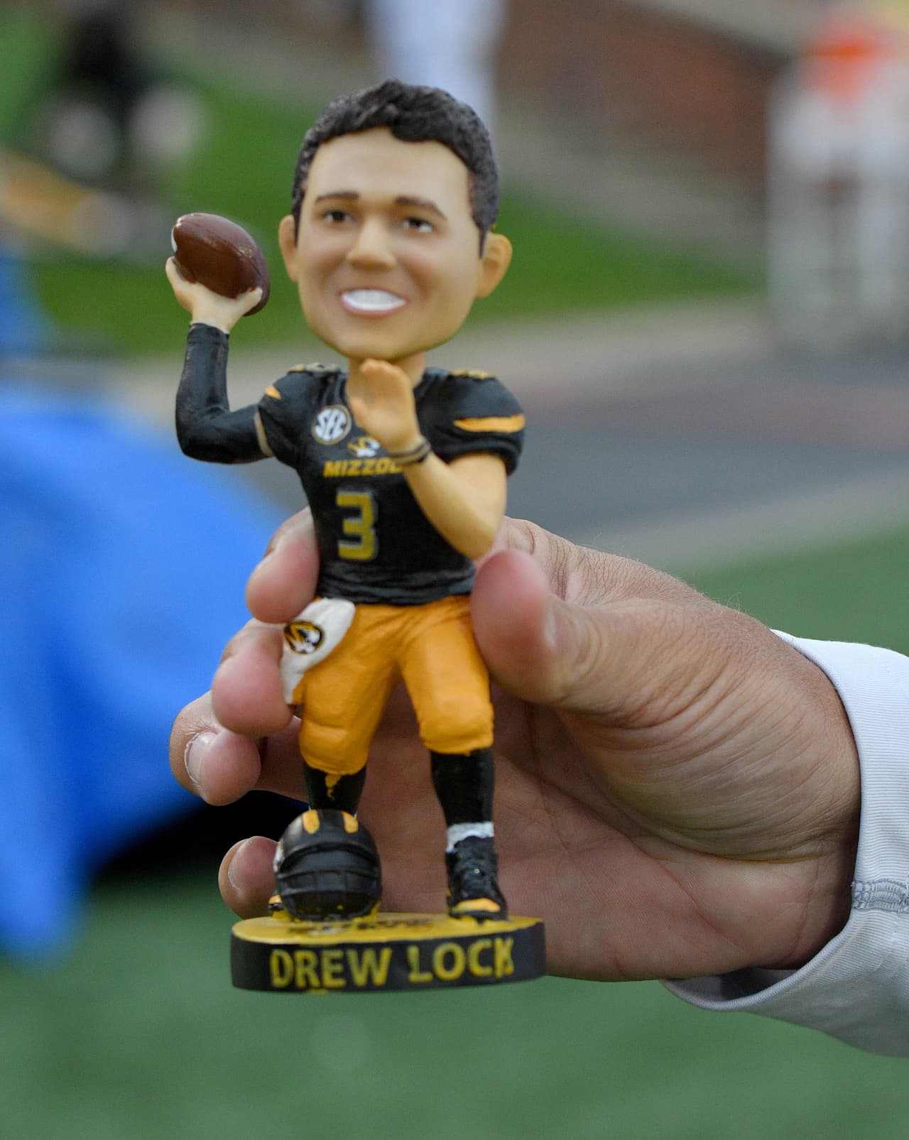 Sep 8, 2018; Columbia, MO, USA; A fan holds up a Missouri Tigers quarterback Drew Lock (3) bobble head during the first half against the Wyoming Cowboys at Memorial Stadium/Faurot Field. Mandatory Credit: Denny Medley-USA TODAY Sports