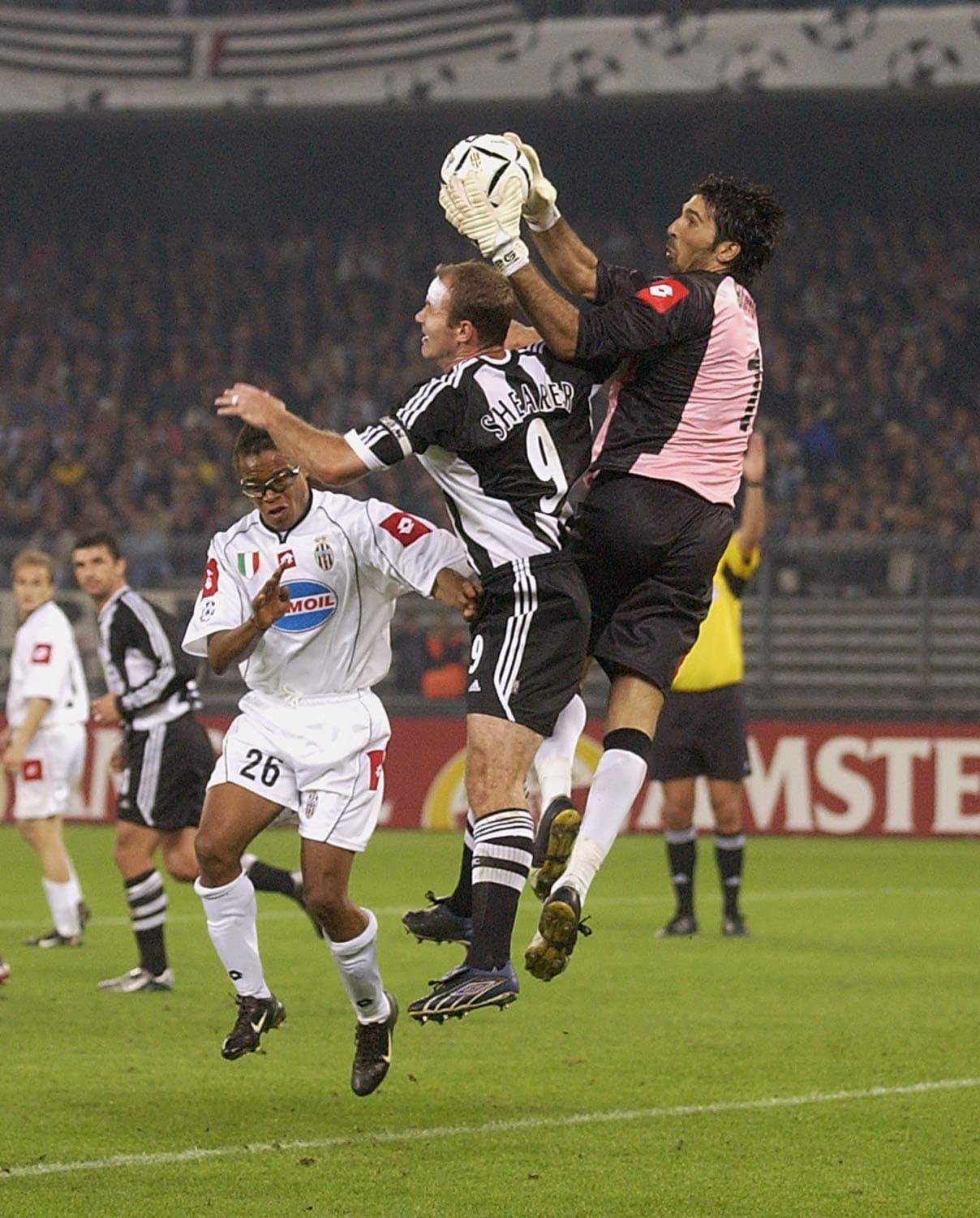 TURIN - OCTOBER 1: Alan Shearer of Newcastle United and Gianluigi Buffon of Juventus in action during the UEFA Champions League, Group E match between Juventus and Newcastle United at Stadio Delle Alpi, Turin in Italy on October 1, 2002. (Photo by Stu Forster/Getty Images)