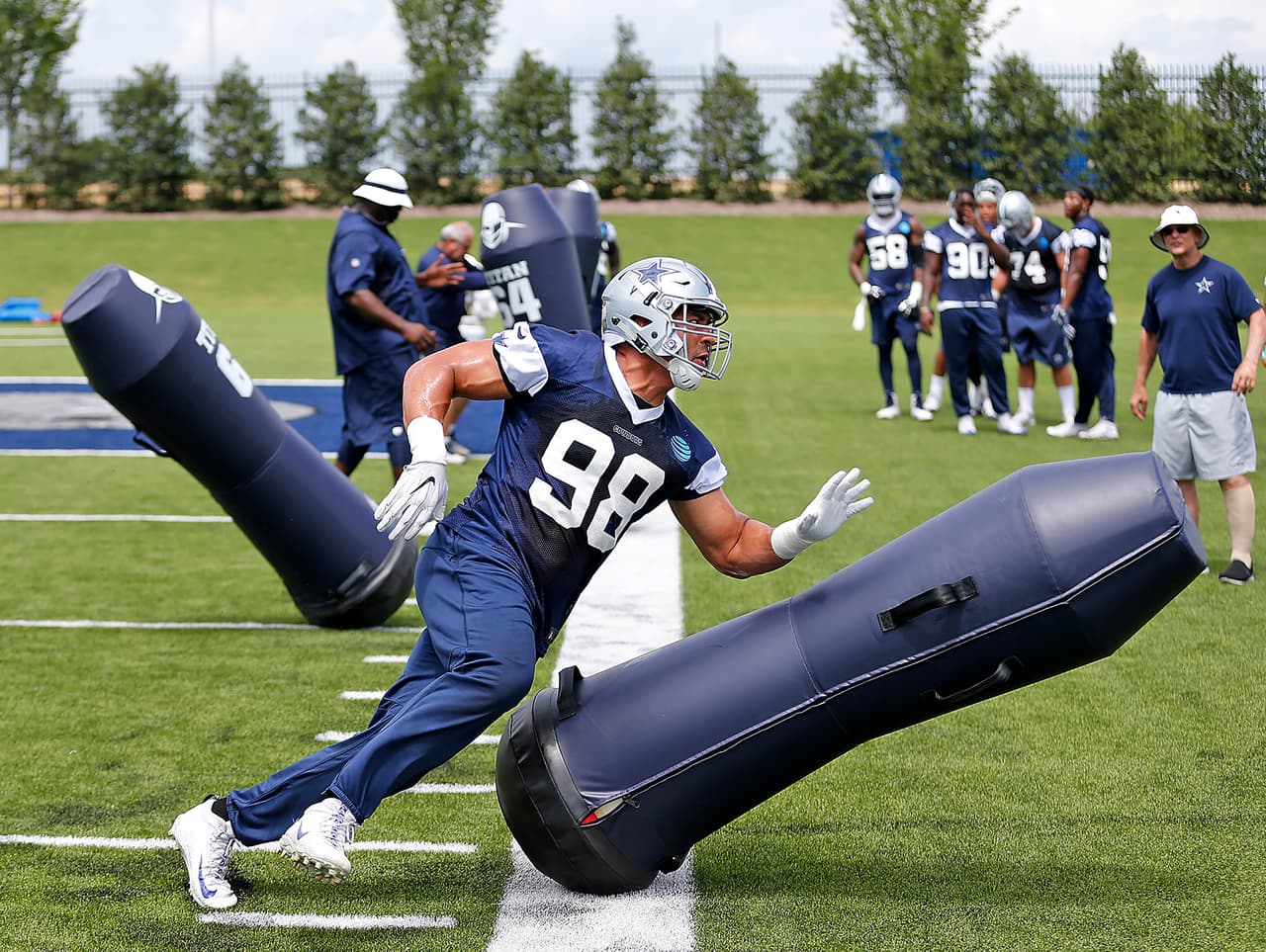 Dallas Cowboys defensive end Tyrone Crawford (98) goes through the blocking dummies during a minicamp practice at its NFL football training facility in Frisco, Texas, Tuesday, June 13, 2017. (James D. Smith via AP)