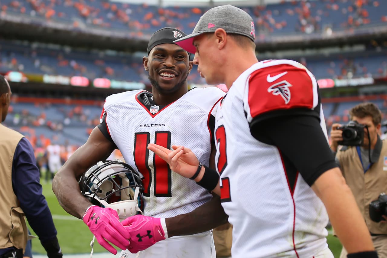 DENVER, CO - OCTOBER 9: Wide receiver Julio Jones #11 and quarterback Matt Ryan #2 of the Atlanta Falcons talk after defeating the Denver Broncos 23-16 at Sports Authority Field at Mile High on October 9, 2016 in Denver, Colorado. (Photo by Justin Edmonds/Getty Images)