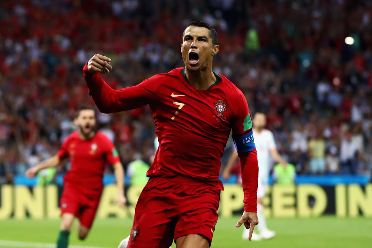 SOCHI, RUSSIA - JUNE 15: Cristiano Ronaldo of Portugal celebrates after scoring his team's first goal during the 2018 FIFA World Cup Russia group B match between Portugal and Spain at Fisht Stadium on June 15, 2018 in Sochi, Russia. (Photo by Dean Mouhtaropoulos/Getty Images)