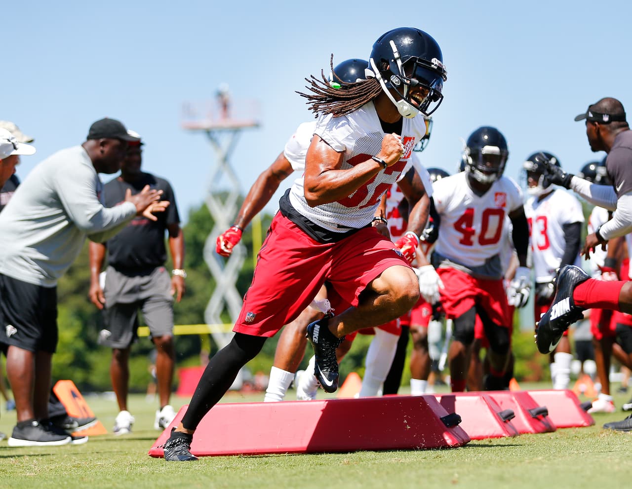 Atlanta Falcons cornerback Jalen Collins (32) runs drill during their NFL football practice Thursday, June 16, 2016, in Flowery Branch, Ga. (AP Photo/John Bazemore)