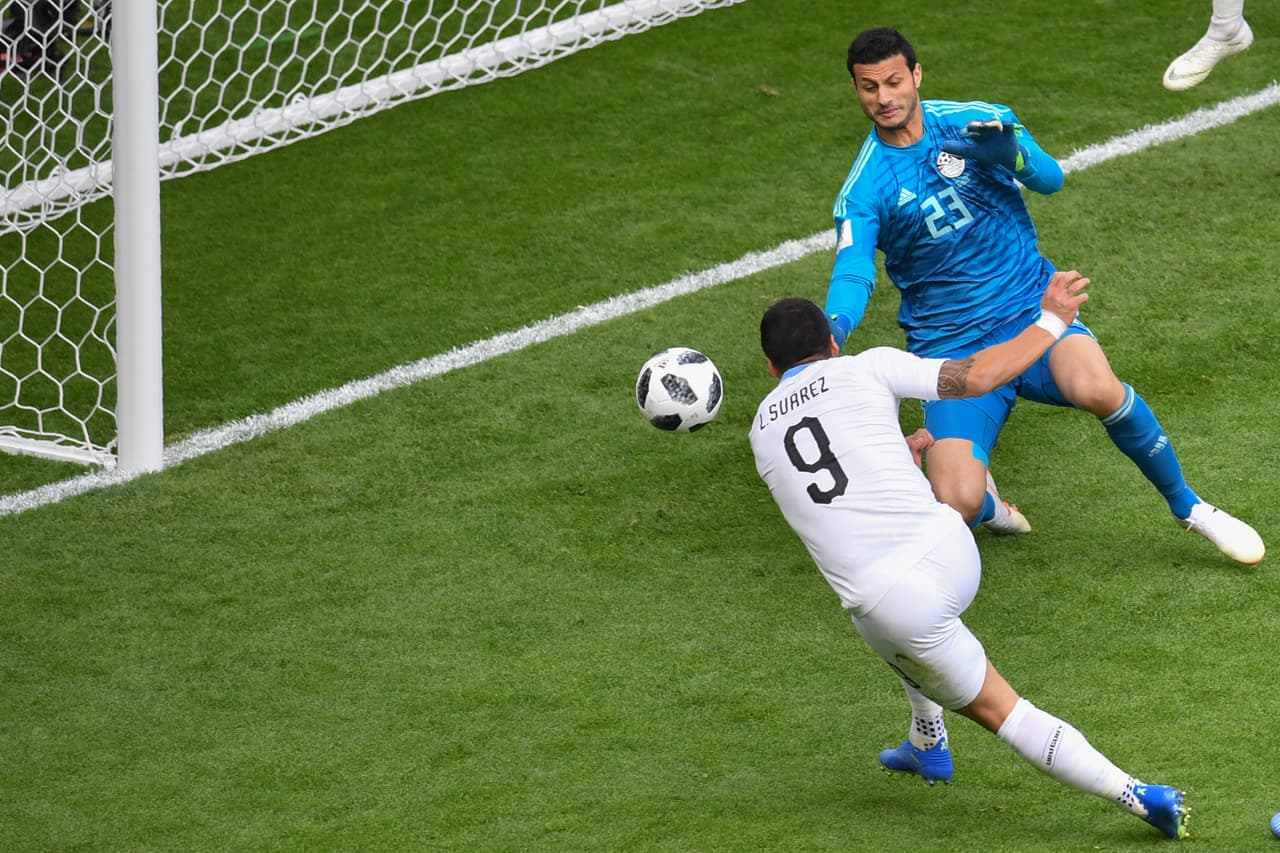 Uruguay's forward Luis Suarez (L) fires the ball into the side netting missing a chance during the Russia 2018 World Cup Group A football match between Egypt and Uruguay at the Ekaterinburg Arena in Ekaterinburg on June 15, 2018. (Photo by HECTOR RETAMAL / AFP) / RESTRICTED TO EDITORIAL USE - NO MOBILE PUSH ALERTS/DOWNLOADS (Photo credit should read HECTOR RETAMAL/AFP/Getty Images)