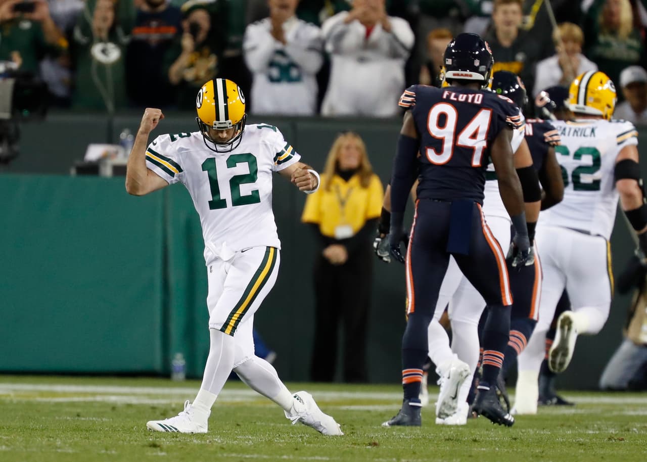 Green Bay Packers' Aaron Rodgers celebrates a touchdown pass during the first half of an NFL football game against the Chicago Bears Thursday, Sept. 28, 2017, in Green Bay, Wis. (AP Photo/Matt Ludtke)