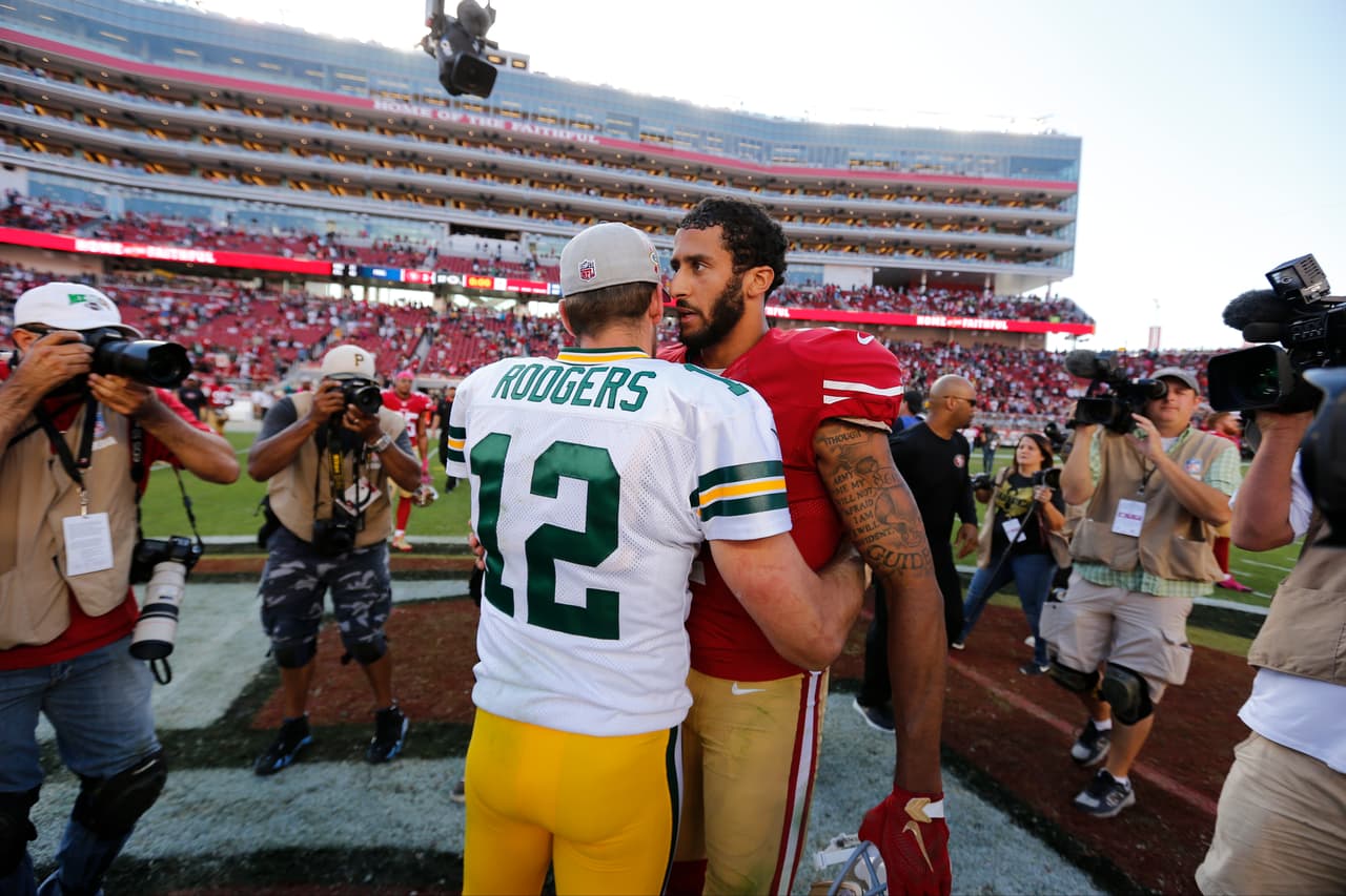 Green Bay Packers quarterback Aaron Rodgers (12) shakes hands with San Francisco 49ers quarterback Colin Kaepernick (7) during the NFL regular season game on Oct. 4, 2015 in Santa Clara, Calif. (Ric Tapia via AP)